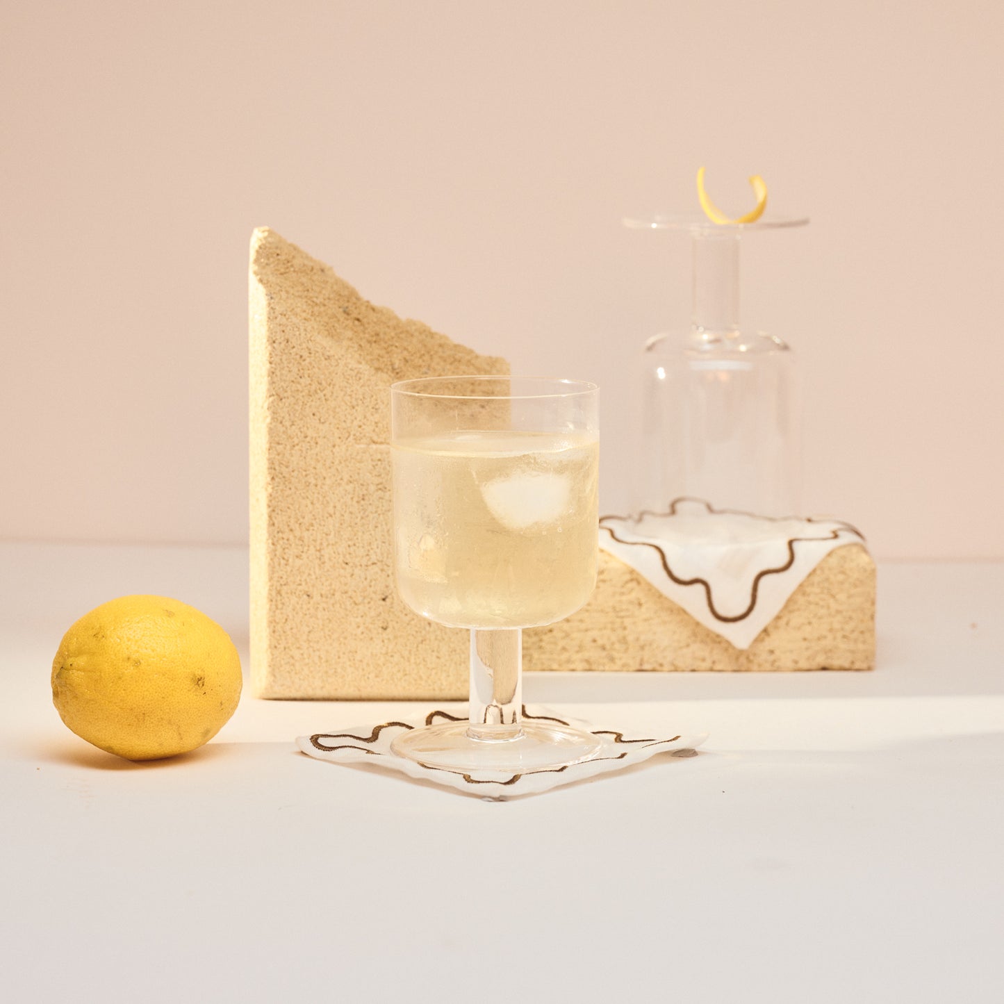 Gin cocktail glasses and wavy hand embroidered cocktail napkins 