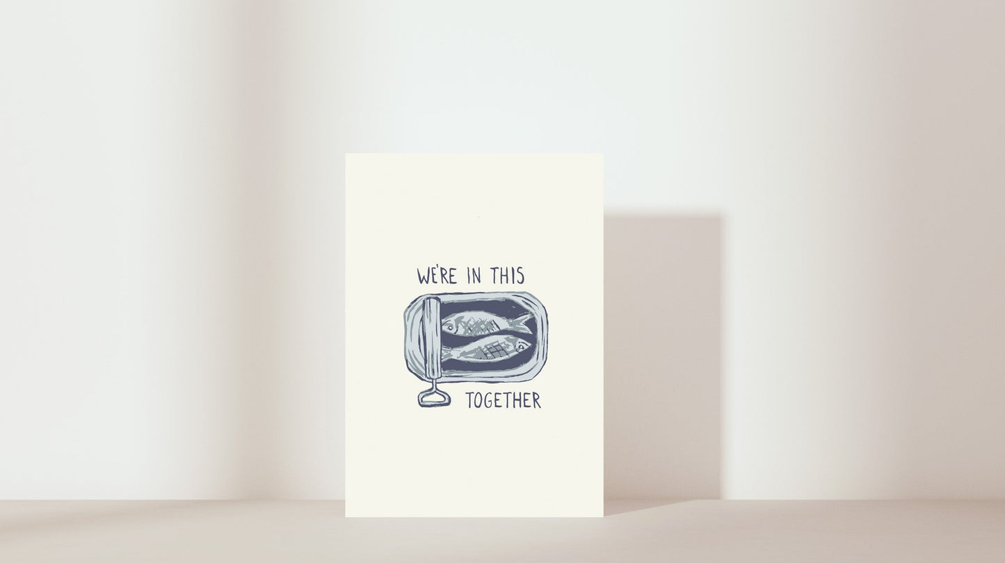 'We're in this together' sardines in tin. colour: blue and neutral colours