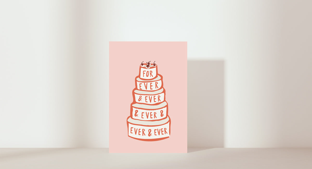 Stacked wedding cake with forever & ever & ever pink icing