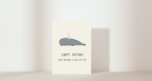 'Have a whale of a birthday' painting of a whale with a party hat on 