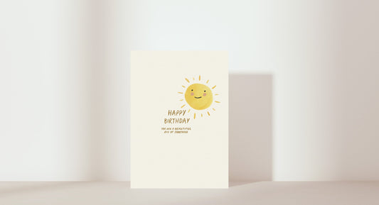 'Happy birthday. You are a beautiful ray of sunshine'. Image of sun smiling. Colour: yellow and neutral. 